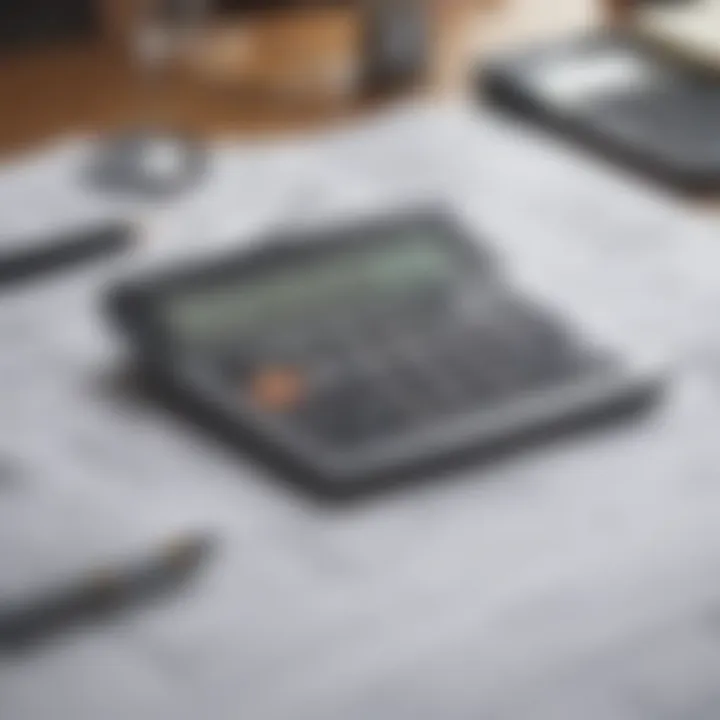 Calculator and house plans on a desk