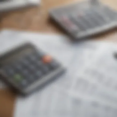 A calculator and financial documents on a table